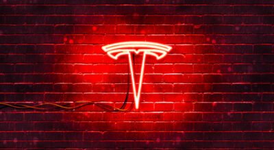 tesla red logo 4k red brickwall tesla logo cars brands 1